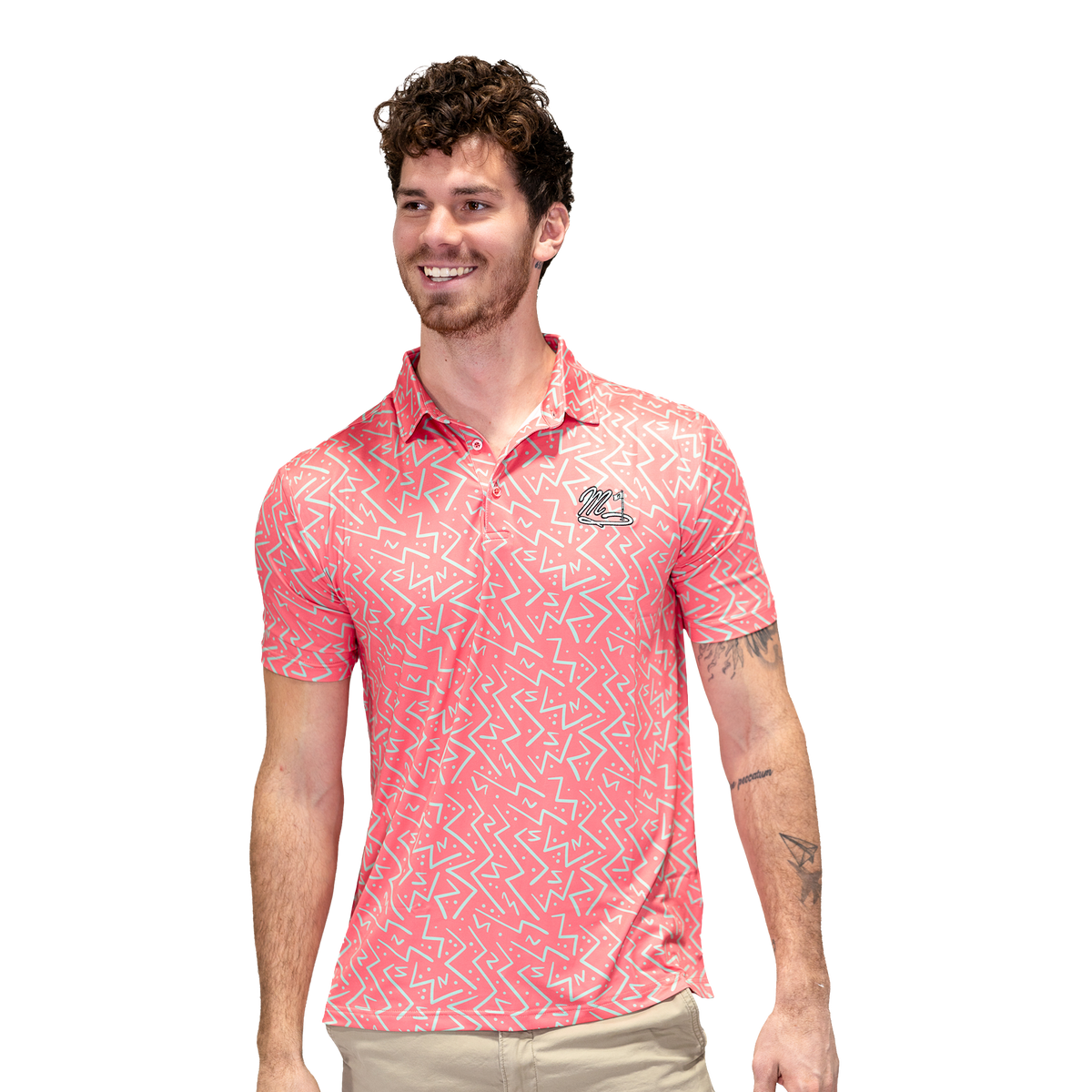 Golfer wearing the Candy Coral performance polo